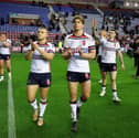 Mikey Lewis (left), Ethan Havard (centre) and John Bateman (right) applaud the England fans after their win over Samoa at the Brick Community Stadium in Wigan