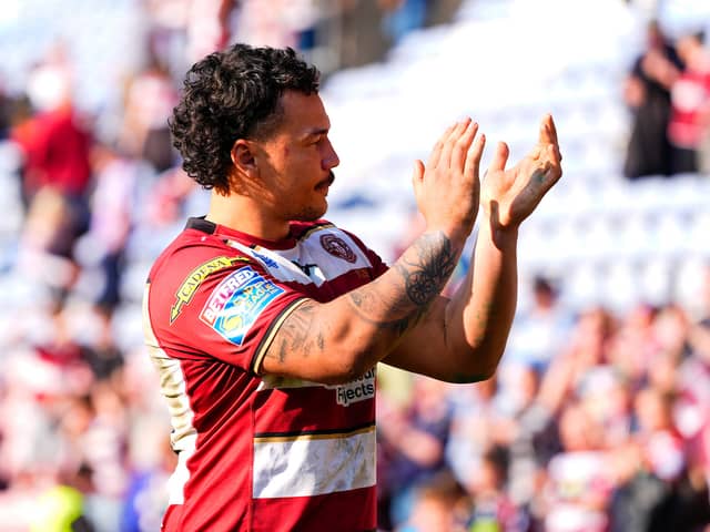 Tyler Dupree applauds the Wigan Warriors fans at the Brick Community Stadium