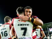 Patrick Mago hugs Wigan Warriors teammate Harry Smith after a Wigan Warriors victory