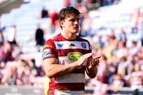 Liam Byrne applauds the Wigan Warriors fans