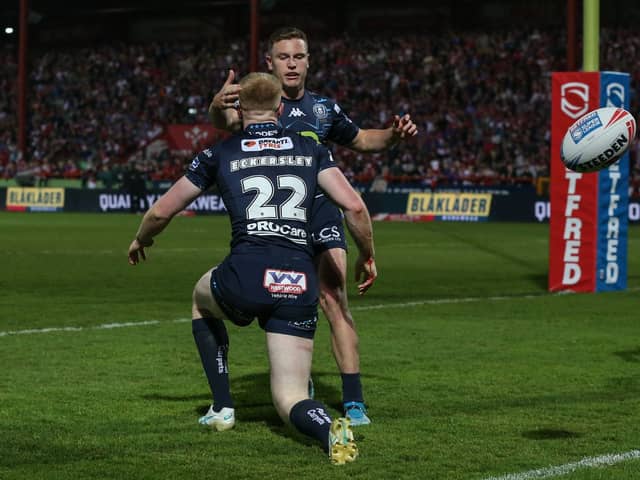 Zach Eckersley and Jai Field celebrate a Wigan Warriors try
