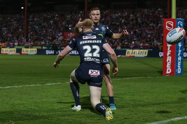 Zach Eckersley and Jai Field celebrate a Wigan Warriors try