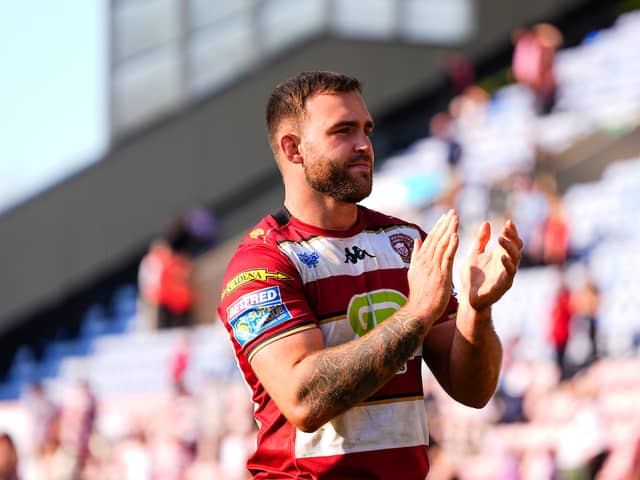 Kaide Ellis applauds the Wigan Warriors fans