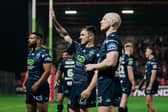 Harry Smith (centre) of Wigan Warriors celebrating a win with the fans
