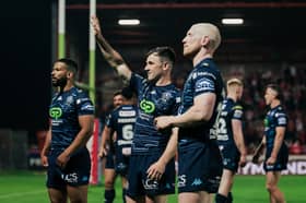 Harry Smith (centre) of Wigan Warriors celebrating a win with the fans