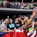Wigan Warriors hooker Kruise Leeming poses for a selfie with fans in Las Vegas