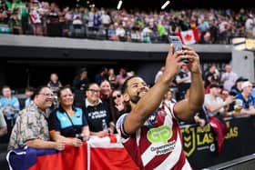 Wigan Warriors hooker Kruise Leeming poses for a selfie with fans in Las Vegas