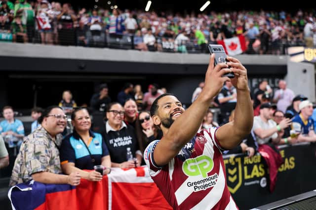 Wigan Warriors hooker Kruise Leeming poses for a selfie with fans in Las Vegas