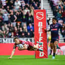 Jai Field scoring a try for Wigan Warriors against St Helens on Good Friday