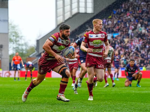 Wigan Warriors winger Abbas Miski scoring a try against St Helens on Good Friday