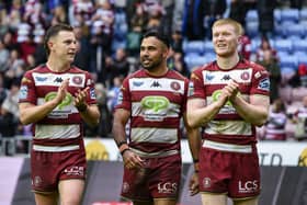 From left to right: Jai Field, Bevan French and Zach Eckersley applaud the fans after Wigan Warriors' win over St Helens on Good Friday