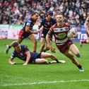 Wigan Warriors star Jai Field scoring a try against St Helens in the Good Friday derby