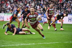 Wigan Warriors star Jai Field scoring a try against St Helens in the Good Friday derby
