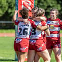 Wigan Warriors celebrate Georgia Wilson's try in their win over Barrow Raiders Ladies