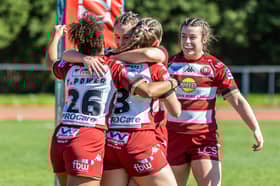 Wigan Warriors celebrate Georgia Wilson's try in their win over Barrow Raiders Ladies