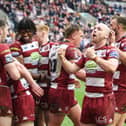Liam Marshall (right) celebrates a Wigan Warriors try on Good Friday