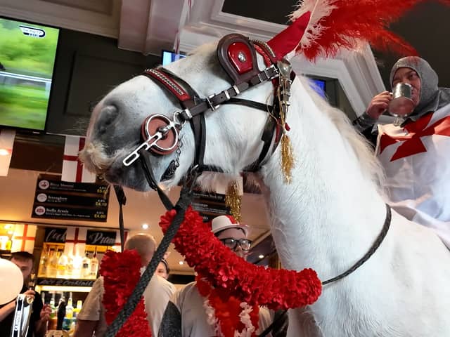 Landlord Chris Bracegirdle rides into the Bloomfield Brewhouse on horseback for St Georges Day.