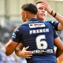 Jai Field and Bevan French celebrating a Wigan Warriors try