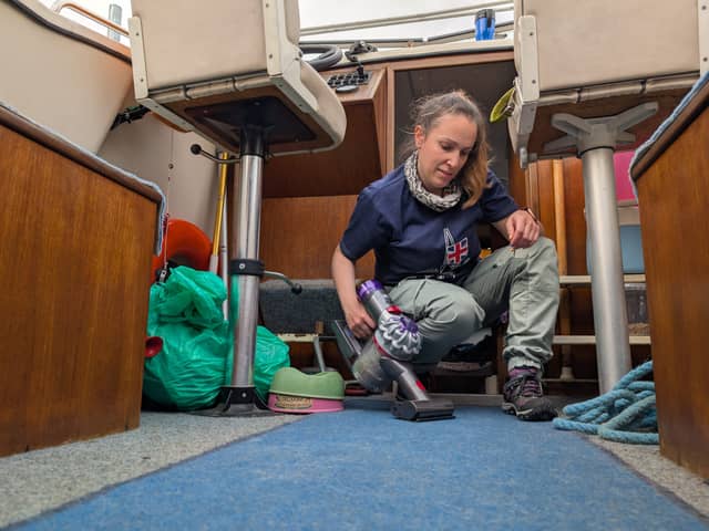 Gareth's wife Lizzy uses the Dyson Car+Boat to clean up the boat's cockpit