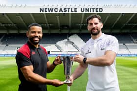 Wigan Warriors hooker Kruise Leeming (left) and Warrington Wolves centre Toby King (right) with the Locker Cup at St James' Park
