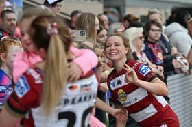 Wigan Warriors star Grace Banks poses for selfies with the fans at Robin Park Arena