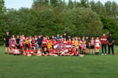 Leyland Warriors junior players pictured with Wigan Warriors Community Foundation staff