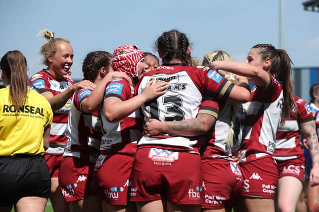 Wigan Warriors celebrate a try in their win over Leeds Rhinos in the Women's Challenge Cup semi-final at York's LNER Community Stadium