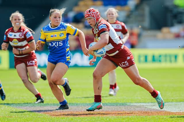 Izzy Rowe in action for Wigan Warriors against Leeds Rhinos in the Women's Challenge Cup semi-final