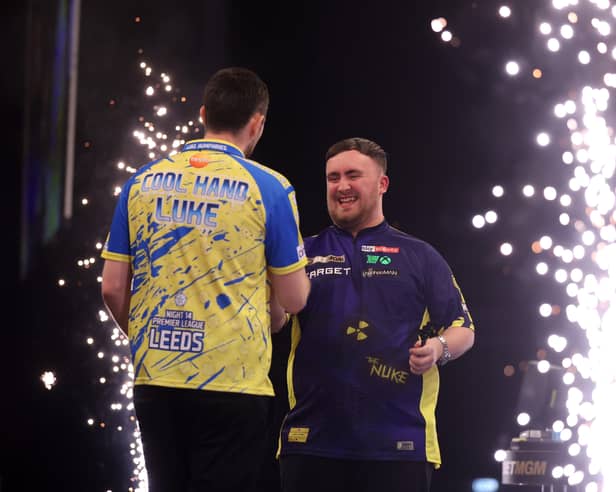 Luke Humphries (L) and Luke Littler (R) after a Premier League Darts match