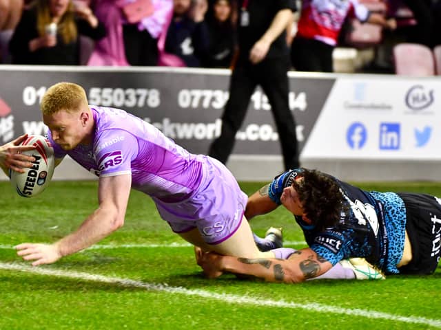 Zach Eckersley scoring a try for Wigan Warriors against Leigh Leopards