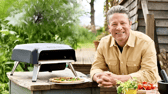 Jamie Oliver with his Tefal gas pizza oven, designed for quick, even-cooked homemade pizzas in the garden