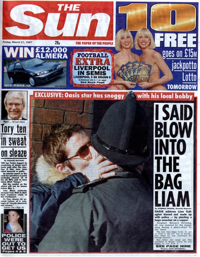 The famous Wigan Evening Post photo of Liam Gallagher kissing a policeman.