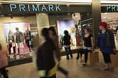 Shoppers walk past a Primark clothing store. The retailer's parent company has warned large UK stores could be under 'pressure' from tax changes (Photo: Sean Gallup/Getty Images)