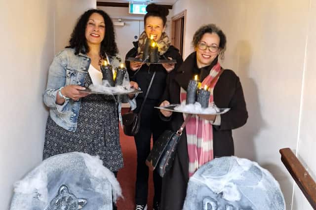 Visitors with spooky props made in a workshop run by Elaine Delaney
