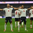 Harry Kane (left) and Jude Bellingham (right) celebrate England's first goal in the win over Mexico at the World Cup