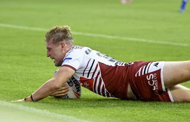 Josh Cartwright scoring a try for Wigan Warriors