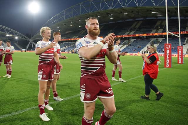 Luke Thompson applauds the Wigan Warriors fans