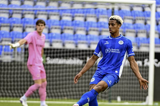 Tobias Brenan in action for Wigan Athletic in a pre-season friendly against Port Vale