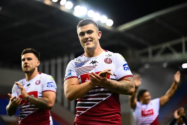 Brad O'Neill applauds the Wigan Warriors fans