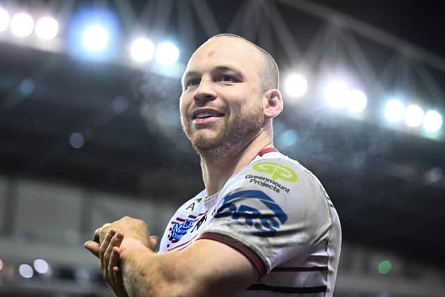 Liam Marshall applauds the Wigan Warriors fans