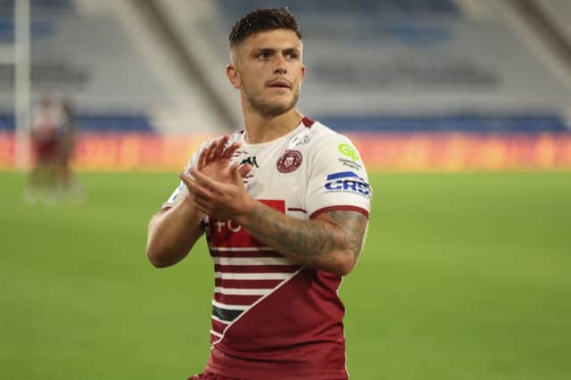 Brad O'Neill applauds the Wigan Warriors fans