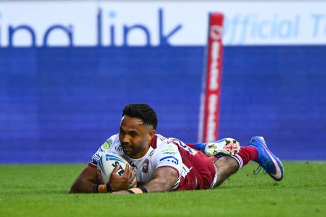 Wigan Warriors star Bevan French scoring a try against St Helens