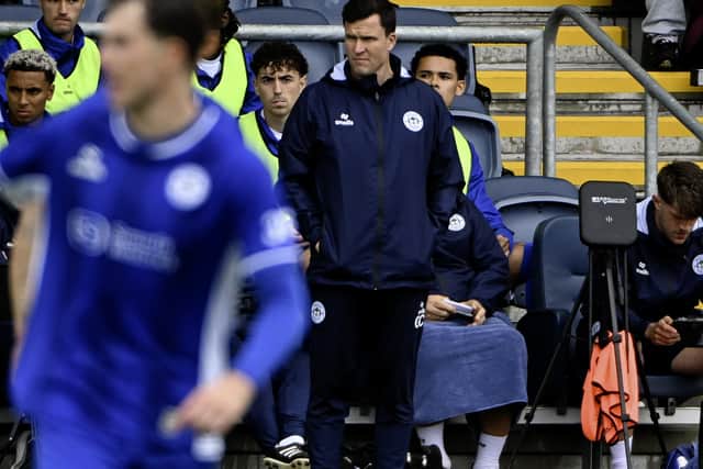 Latics boss Gary Caldwell watches on from the sidelines in his side's 3-0 pre-season win over Fylde