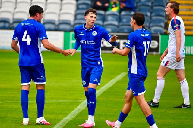 Chris Sze (centre) scored two penalties in Wigan Athletic's 3-0 pre-season win over AFC Fylde