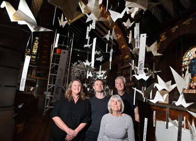 From left, Ruth Atherton, Joe Kiney Whitmore, Susan Whittle and Brian Whitmore, have prepared a murmuration of over 500 paper birds, created by members of the community and assisted by volunteers, to form an art installation in celebrations of the 150th anniversary of St Elizabeth's Church, Aspull.