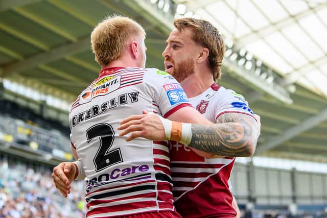 Zach Eckersley (left) celebrating a Wigan Warriors try with Adam Keighran (right)