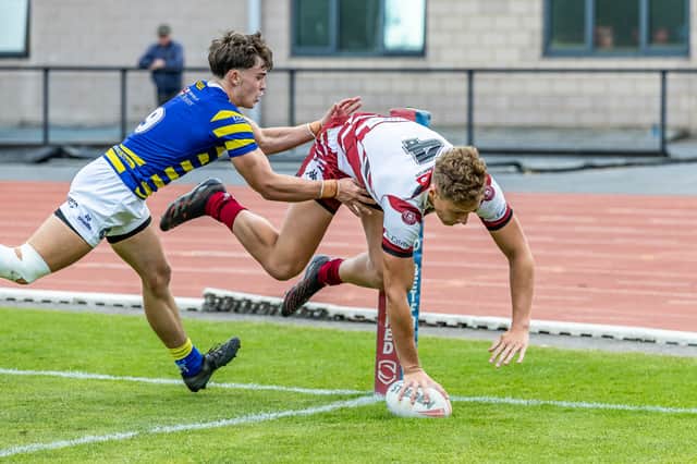 Jovi Bentley-Elliott scoring a try for Wigan Warriors' academy side
