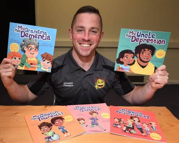 Alex Winstanley with some of his books