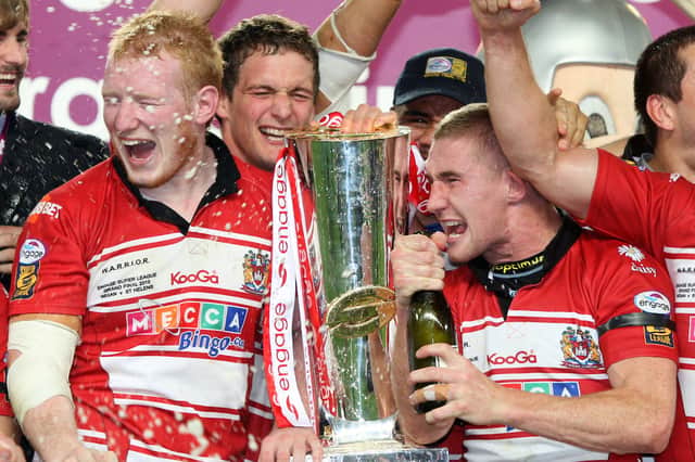Liam Farrell (left) and Sam Tomkins (right) celebrate Wigan Warriors' Super League Grand Final win in 2010