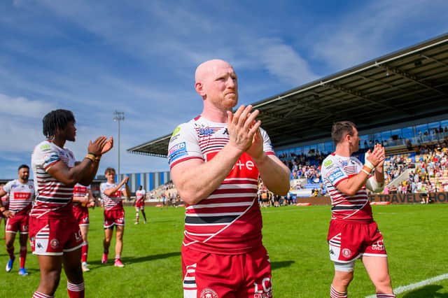 Liam Farrell applauds the Wigan Warriors fans